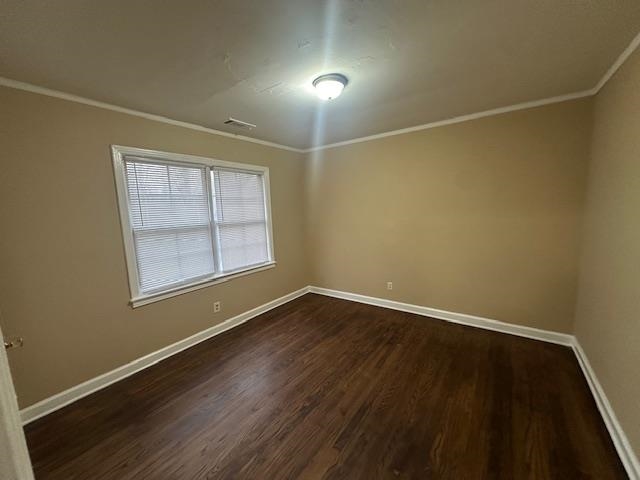 3540 Millington Road Memphis, TN 38127 - Photo 15 of 20 Unfurnished room with crown molding and dark wood-style flooring