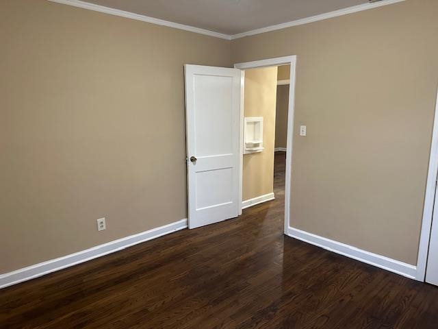 3540 Millington Road Memphis, TN 38127 - Photo 8 of 20 Spare room with ornamental molding and dark wood-style flooring