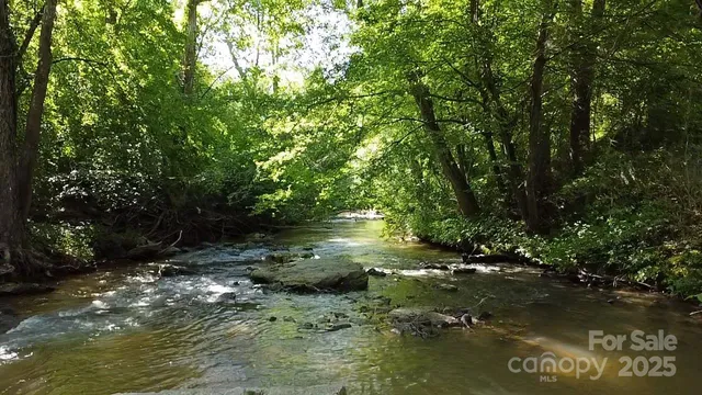 a view of lake with green space