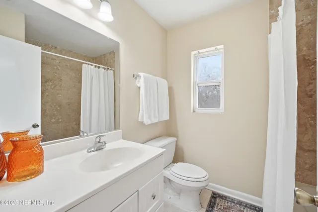 a bathroom with a shower curtain