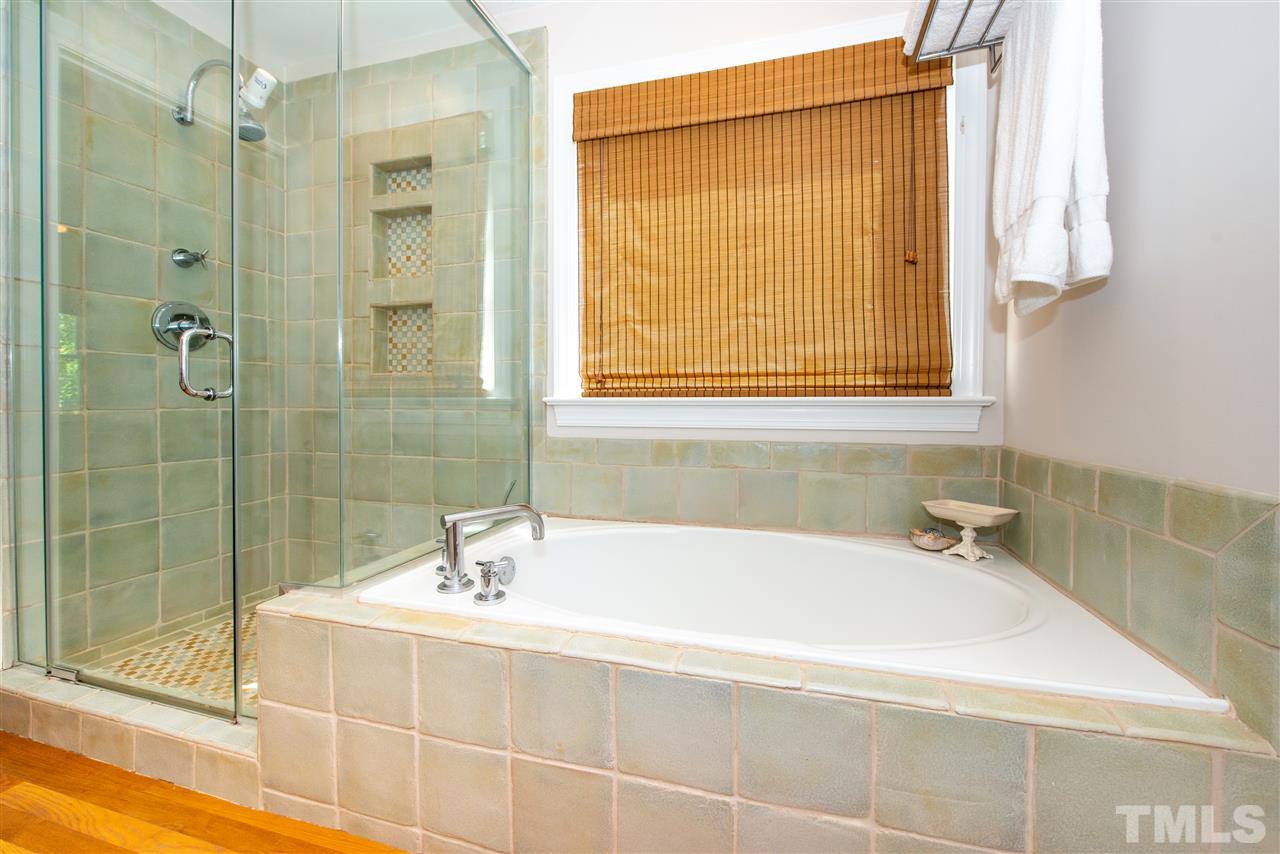 2621 Van Dyke Avenue Raleigh, NC 27607 - Photo 13 of 24 a white bath tub sitting next to a bathroom