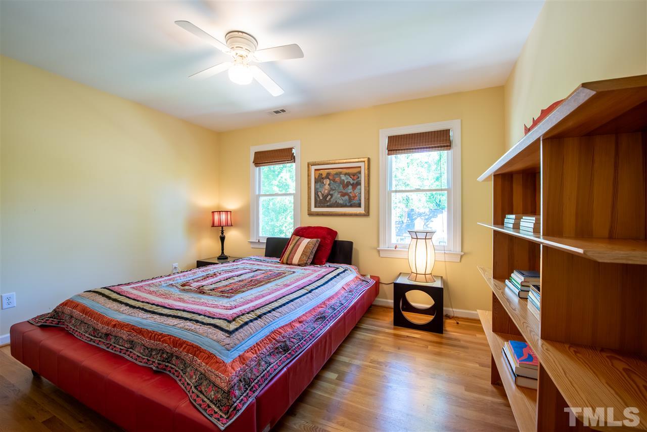 2621 Van Dyke Avenue Raleigh, NC 27607 - Photo 15 of 24 a bedroom with a bed and wooden floor