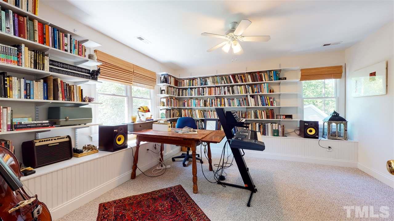 2621 Van Dyke Avenue Raleigh, NC 27607 - Photo 18 of 24 a work room with furniture and a book shelf