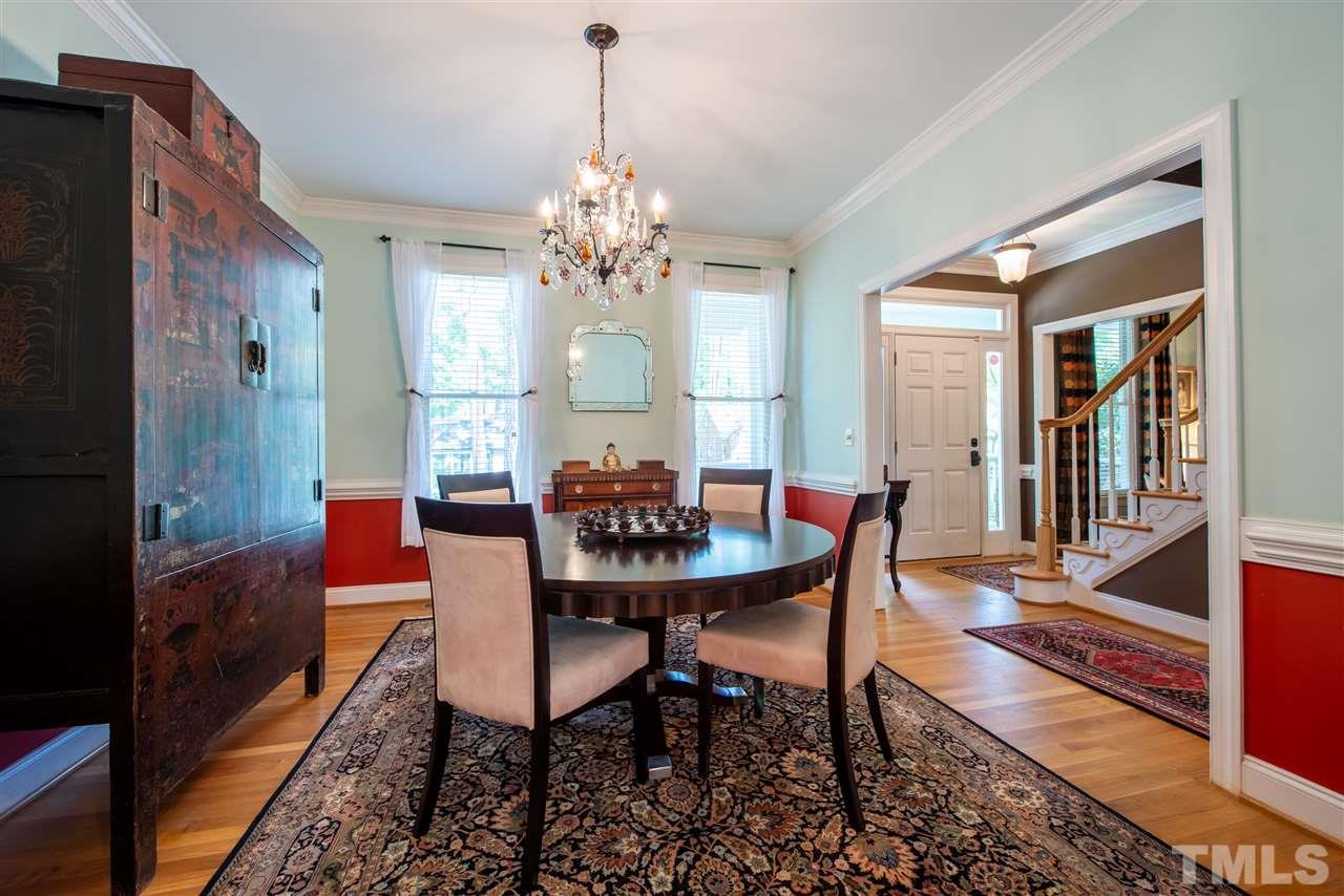2621 Van Dyke Avenue Raleigh, NC 27607 - Photo 3 of 24 a view of a dining room with furniture and a chandelier