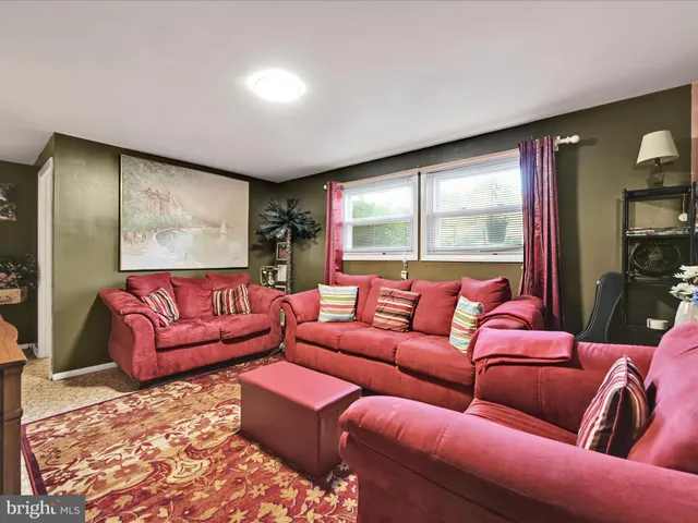 a bathroom with a sink a toilet and a shower curtain