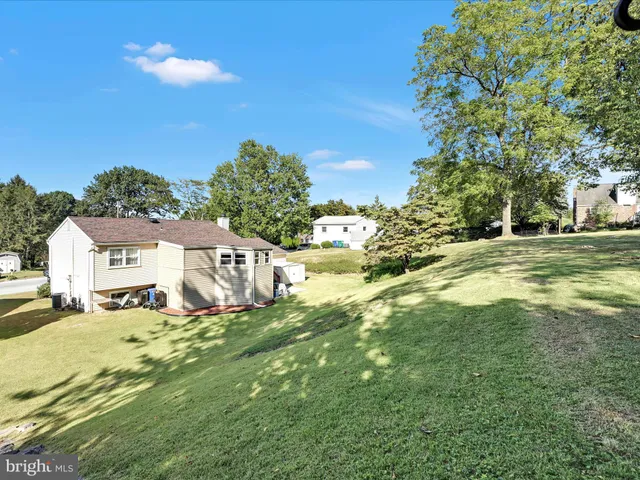 a view of a swimming pool with an outdoor seating and a garden