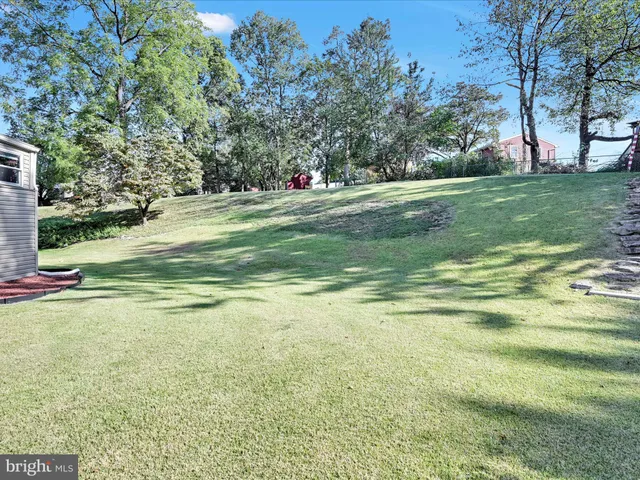 a view of a house with a big yard