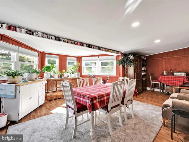 a bedroom with a bed and glass door