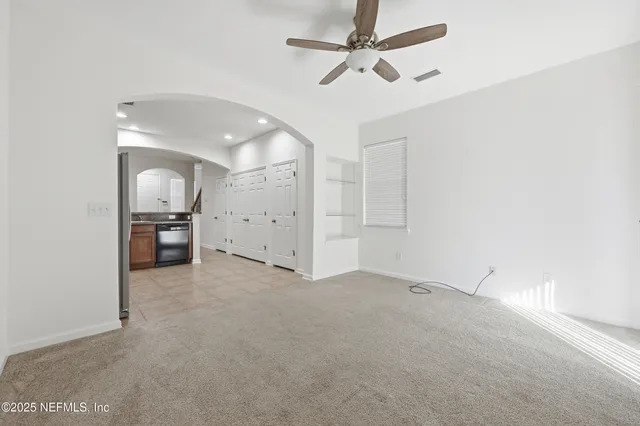 a view of a kitchen with wooden cabinet and a sink