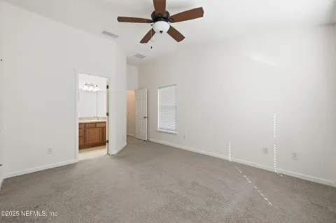 a white bath tub sitting next to a white toilet
