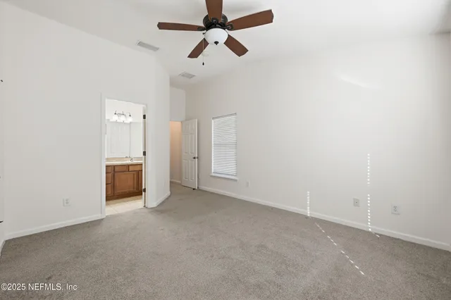 a white bath tub sitting next to a white toilet