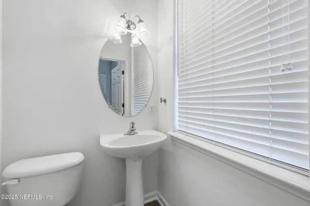 a view of a house with backyard and garden