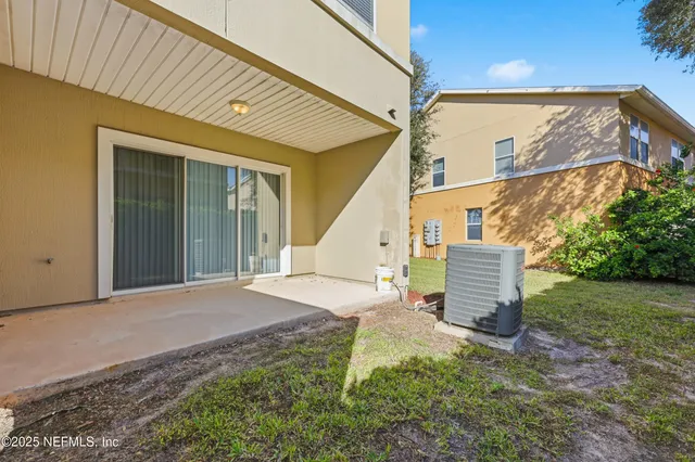 a view of a house with a yard and plants