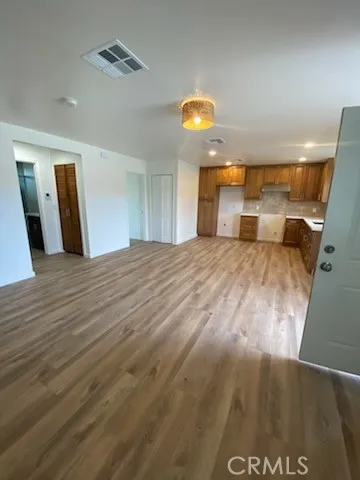 a large room with a bed and a table in it