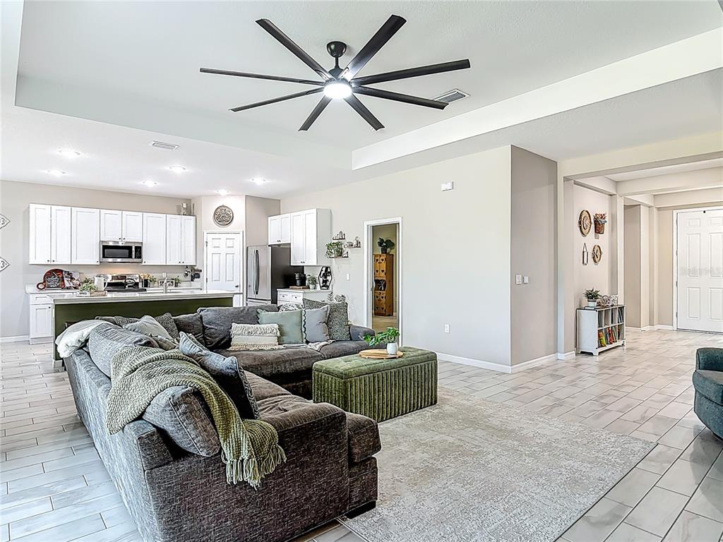 39641 Royal Trails Road Eustis, FL 32736 - Photo 11 of 63 a living room with furniture and a view of kitchen