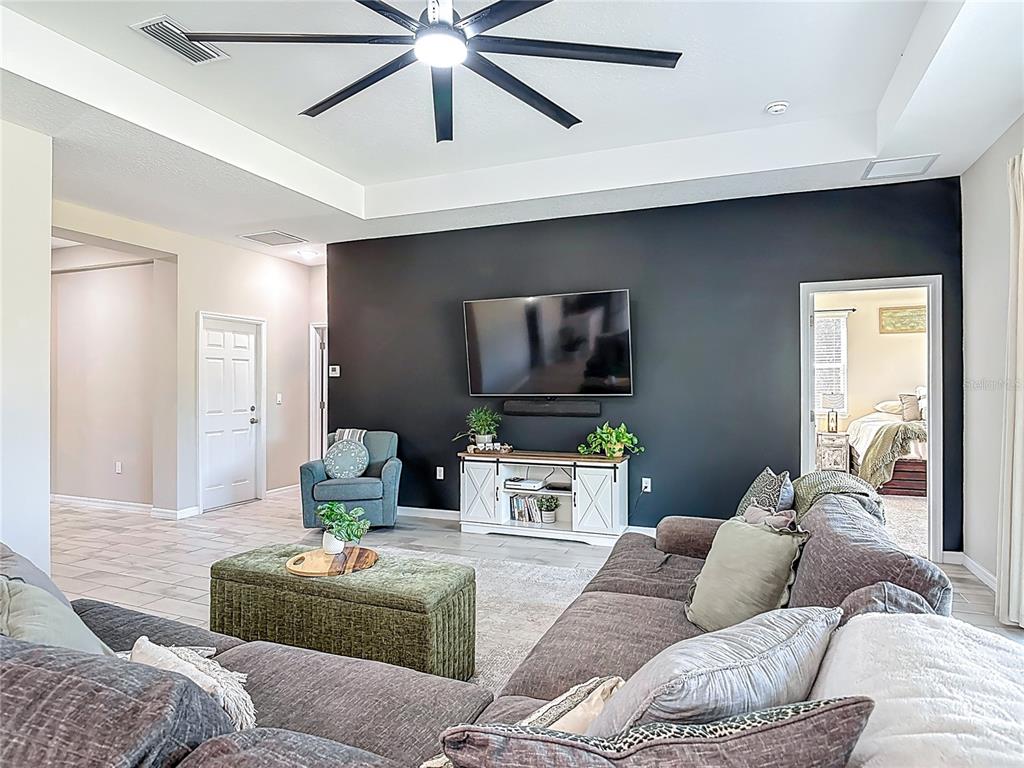 39641 Royal Trails Road Eustis, FL 32736 - Photo 11 of 57 a living room with furniture and a flat screen tv