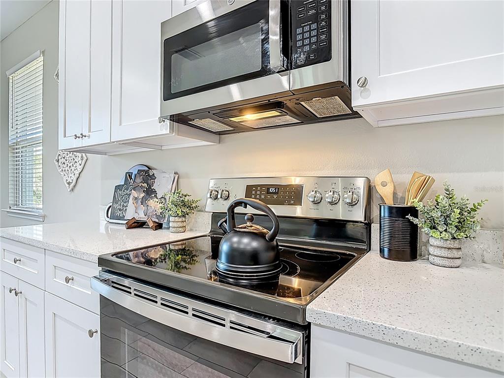 39641 Royal Trails Road Eustis, FL 32736 - Photo 16 of 57 a kitchen with a stove and cabinets