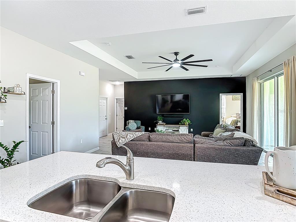 39641 Royal Trails Road Eustis, FL 32736 - Photo 19 of 63 a living room with furniture and a flat screen tv