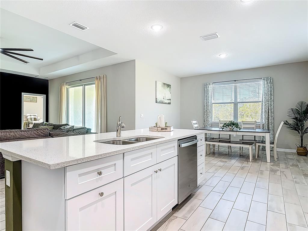 39641 Royal Trails Road Eustis, FL 32736 - Photo 20 of 63 a large white kitchen with a large window