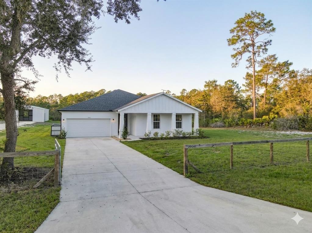 39641 Royal Trails Road Eustis, FL 32736 - Photo 2 of 57 a front view of a house with a yard