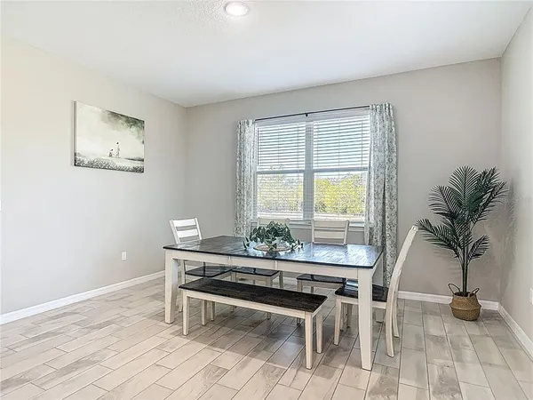 a bedroom with a bed and a flat tv screen on dresser