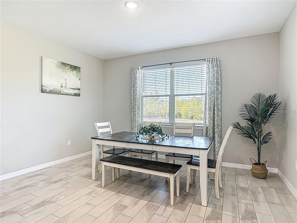 39641 Royal Trails Road Eustis, FL 32736 - Photo 22 of 57 a workspace with furniture and a potted plant