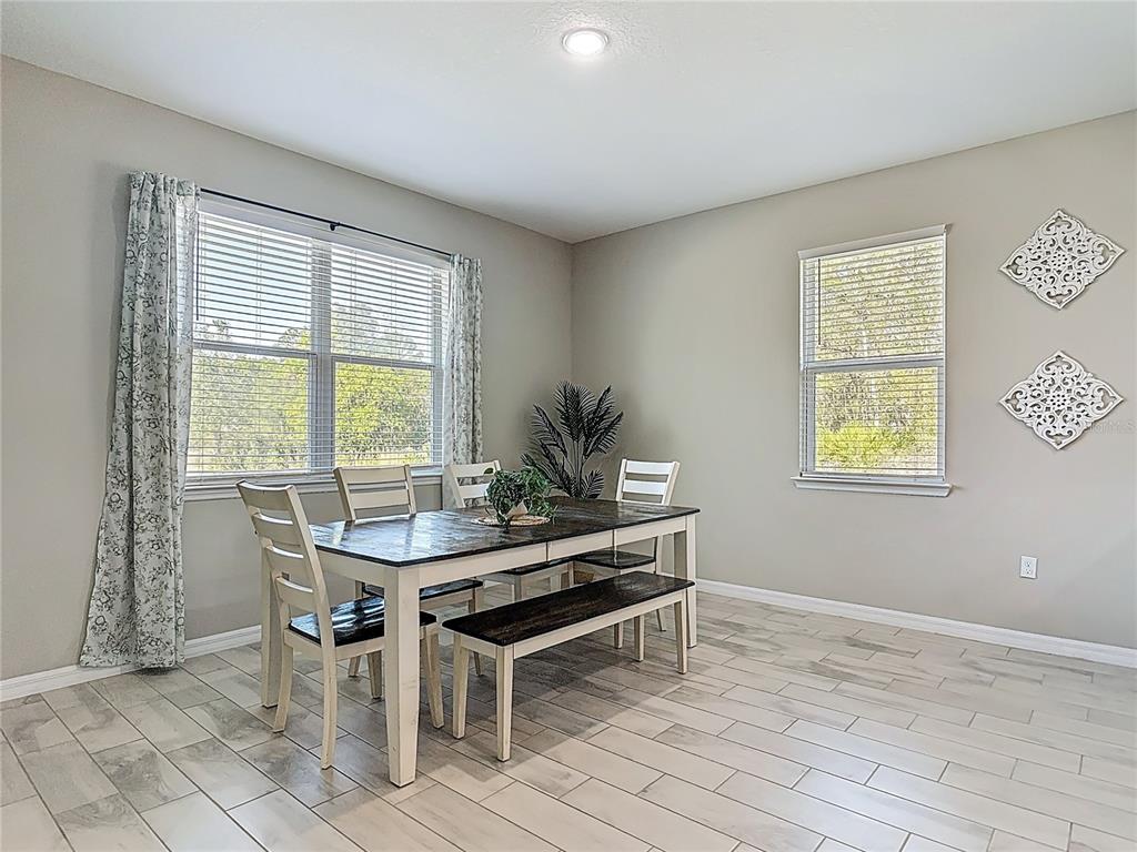 39641 Royal Trails Road Eustis, FL 32736 - Photo 22 of 63 a view of a dining room with furniture and window