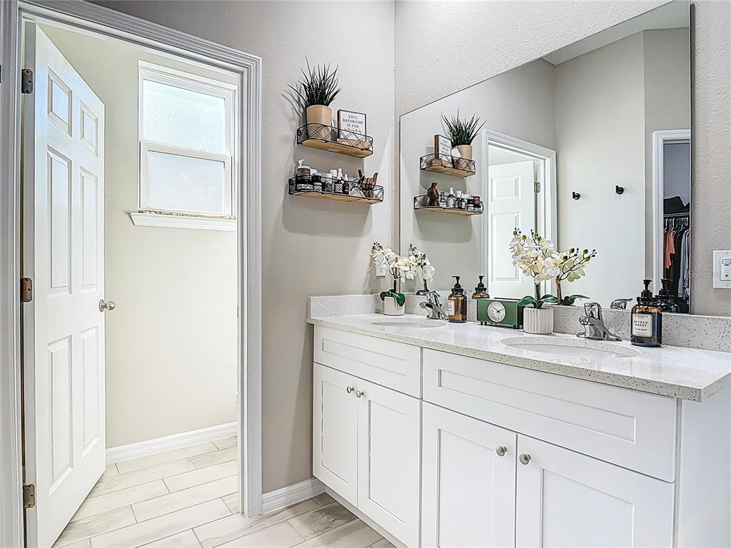 39641 Royal Trails Road Eustis, FL 32736 - Photo 29 of 57 a bathroom with a double vanity sink and
