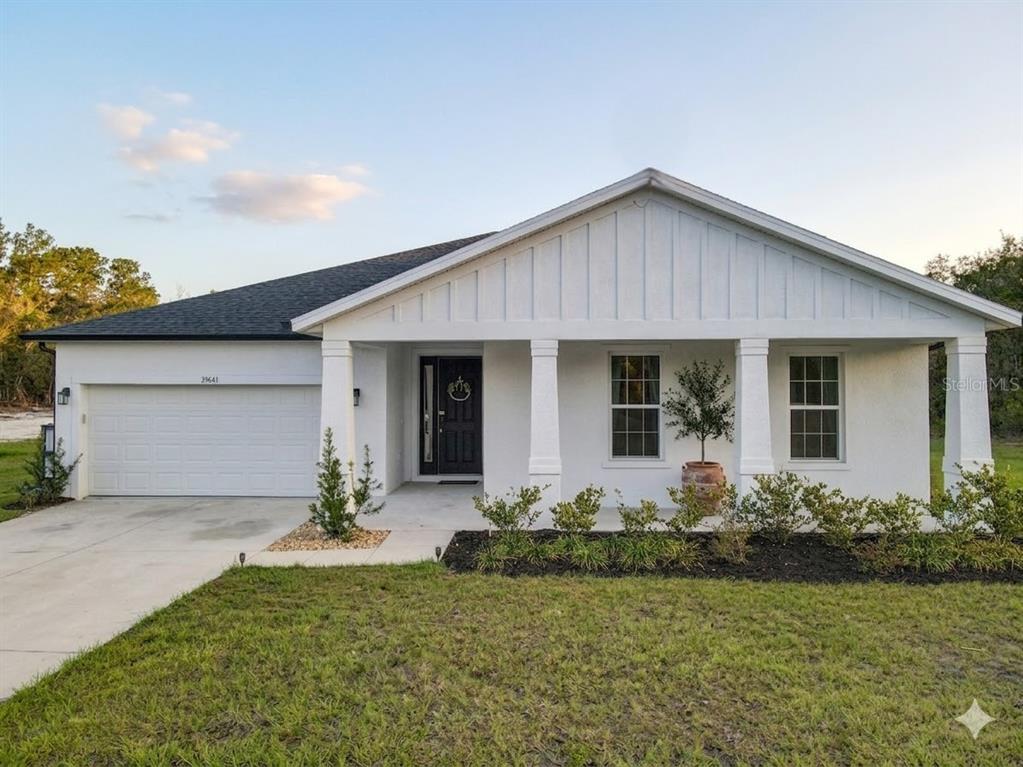 39641 Royal Trails Road Eustis, FL 32736 - Photo 3 of 57 a front view of house with yard and outdoor seating