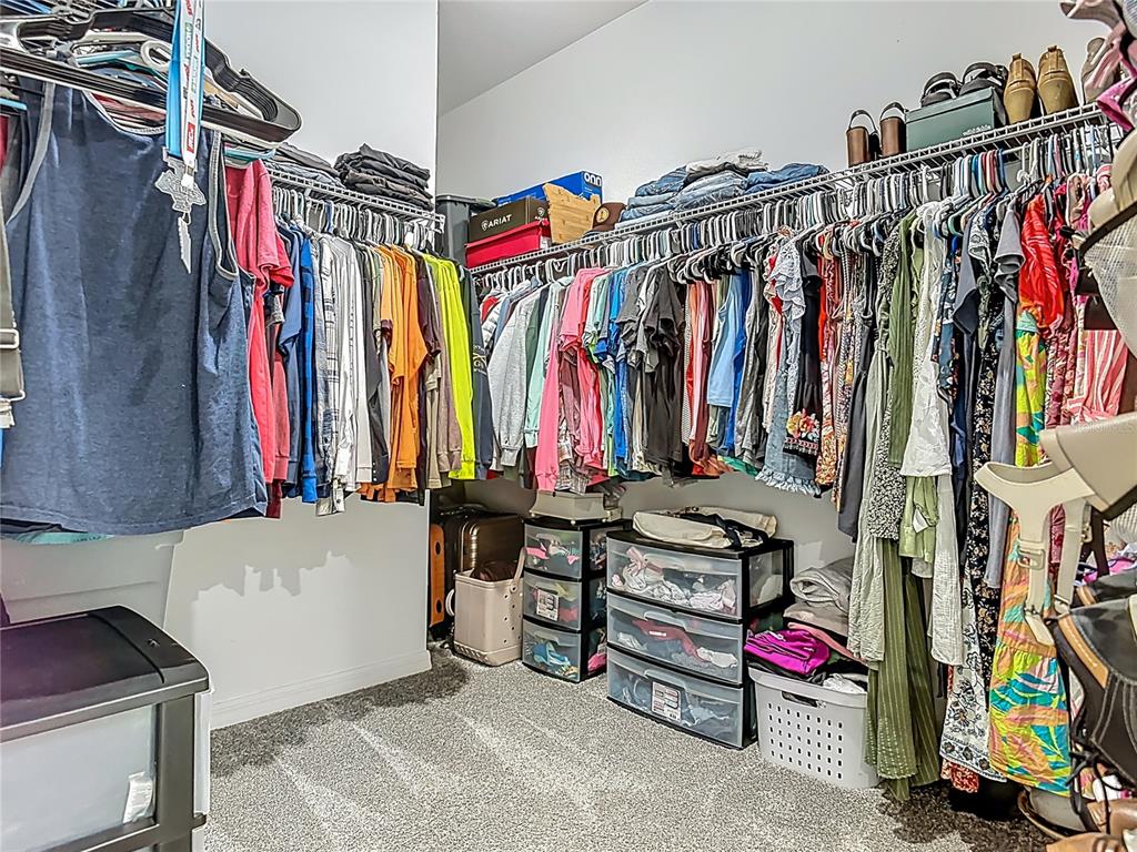 39641 Royal Trails Road Eustis, FL 32736 - Photo 34 of 57 a view of walk in closet with clothes