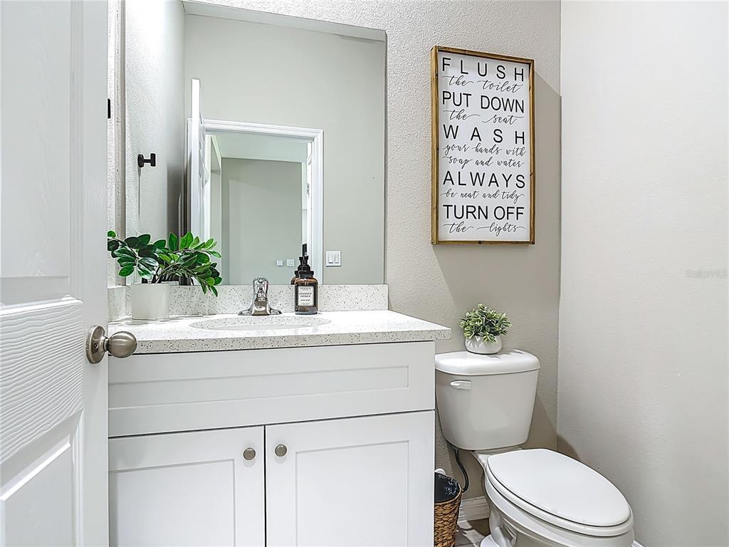 39641 Royal Trails Road Eustis, FL 32736 - Photo 35 of 57 a bathroom with a sink mirror vanity and toilet