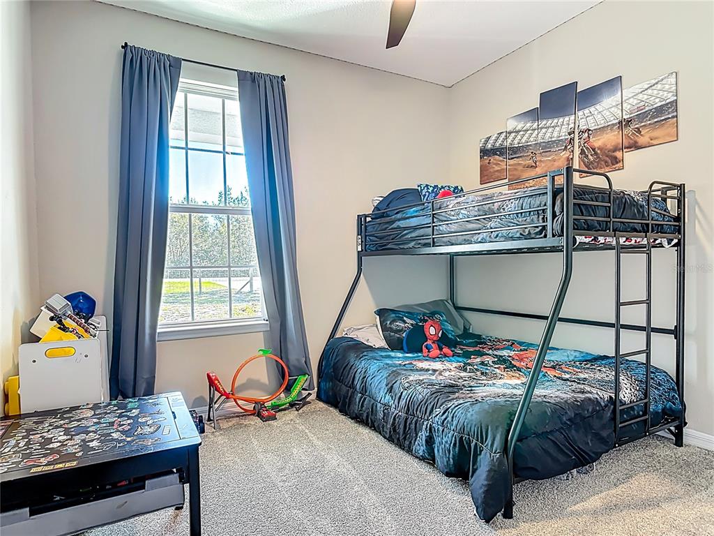 39641 Royal Trails Road Eustis, FL 32736 - Photo 38 of 63 a bedroom with a bed and window