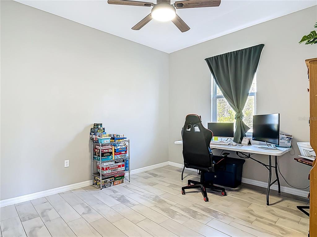 39641 Royal Trails Road Eustis, FL 32736 - Photo 40 of 63 a view of a workspace with furniture and a window
