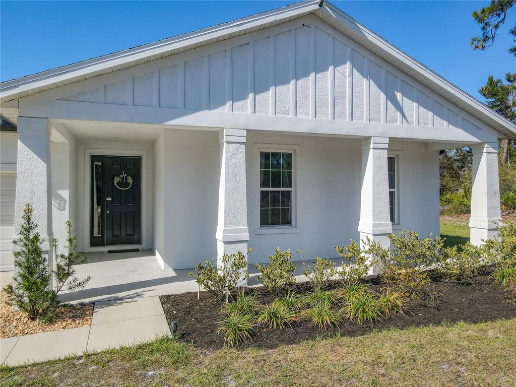 39641 Royal Trails Road Eustis, FL 32736 - Photo 4 of 63 a front view of a house with garden