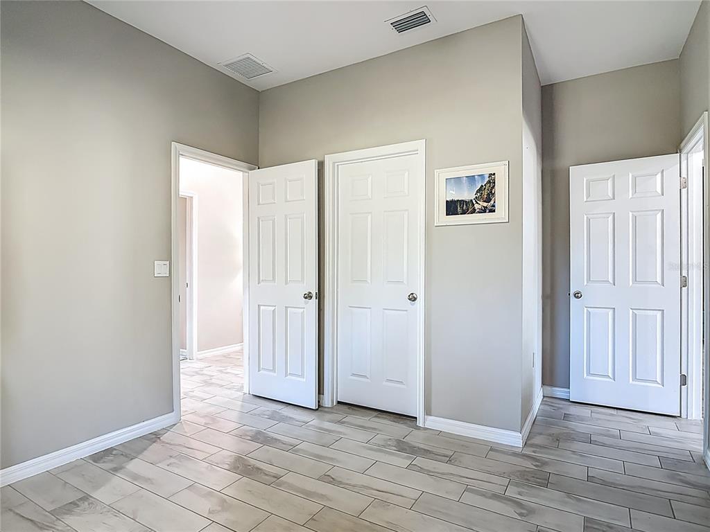 39641 Royal Trails Road Eustis, FL 32736 - Photo 42 of 63 an empty room with wooden floor