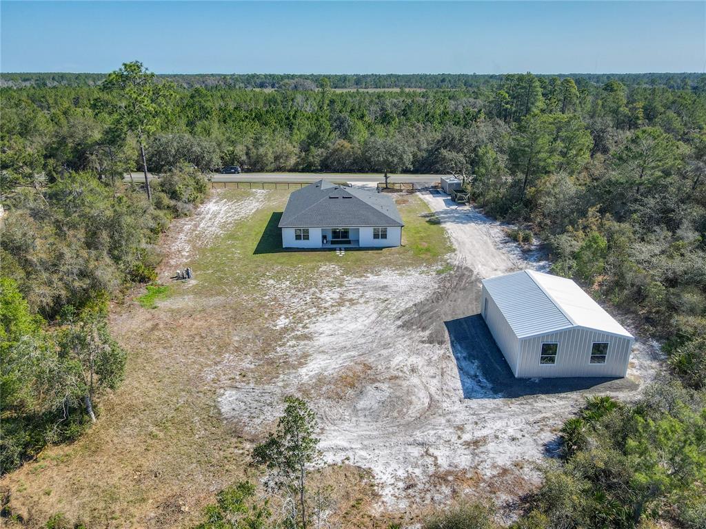 39641 Royal Trails Road Eustis, FL 32736 - Photo 54 of 57 an aerial view of a house with a yard