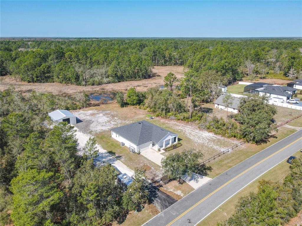 39641 Royal Trails Road Eustis, FL 32736 - Photo 56 of 63 a view of a yard with an outdoor space