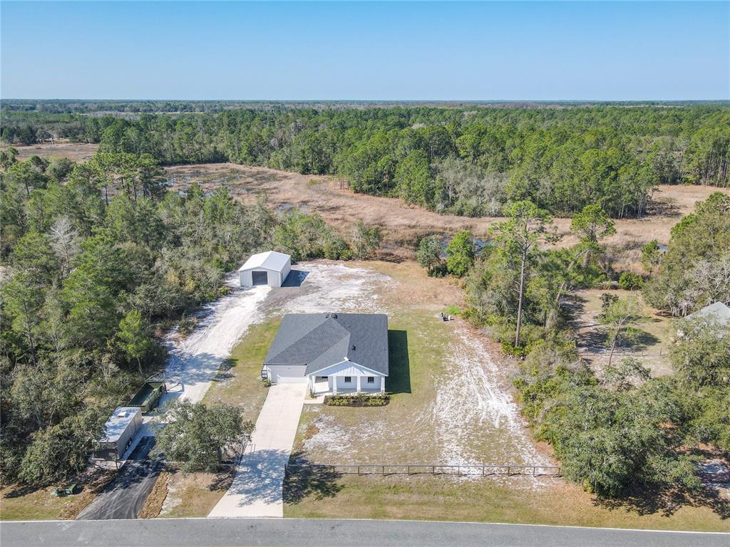 39641 Royal Trails Road Eustis, FL 32736 - Photo 57 of 63 an aerial view of a house with a yard