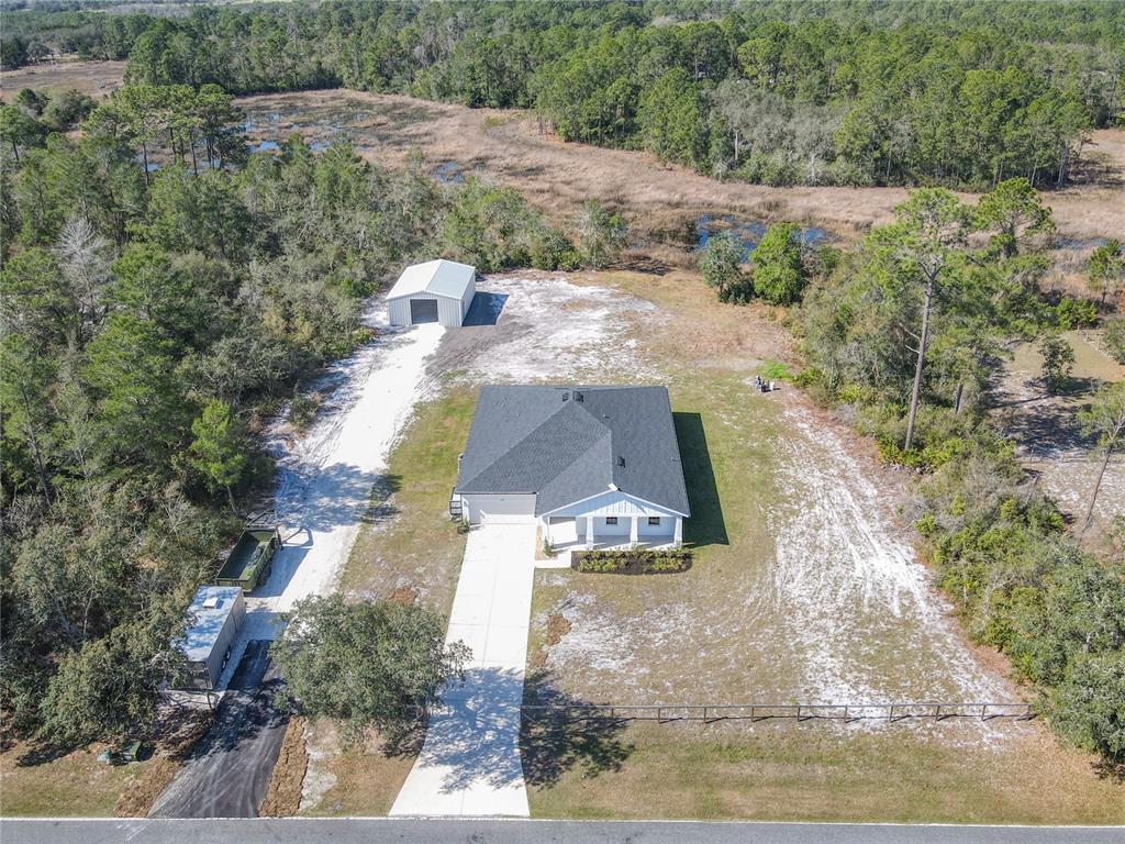 39641 Royal Trails Road Eustis, FL 32736 - Photo 59 of 63 an aerial view of a house with a yard