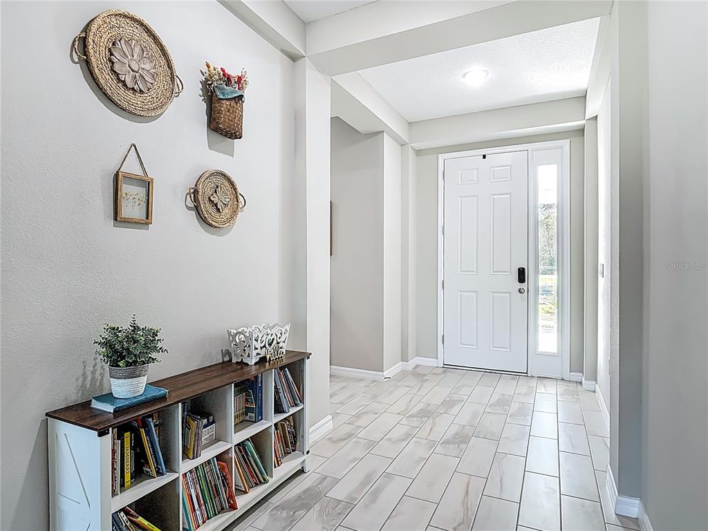 39641 Royal Trails Road Eustis, FL 32736 - Photo 6 of 63 a view of room with furniture and entryway