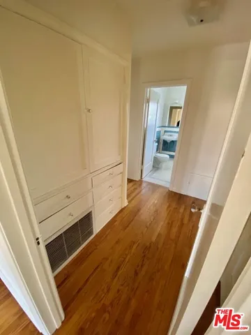 a view of a kitchen from the hallway