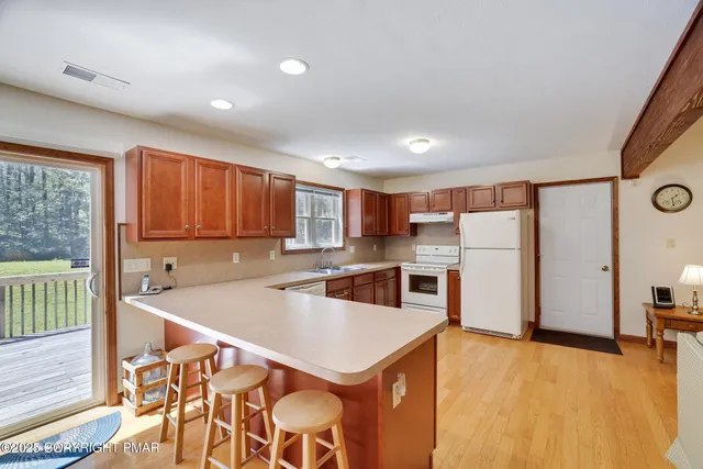 a spacious bedroom with a large bed and furniture