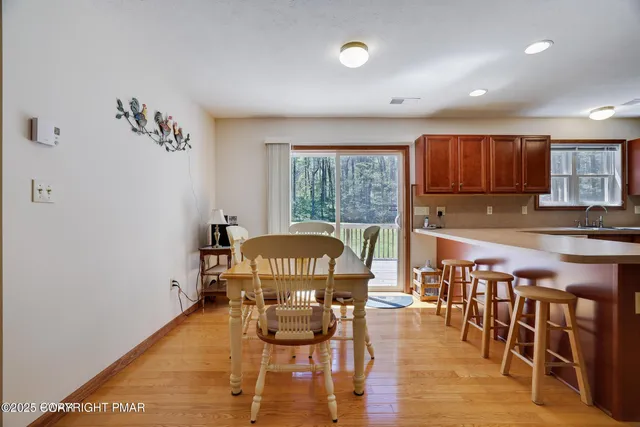 a kitchen with a stove a refrigerator and a sink