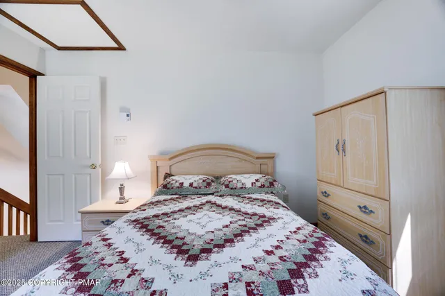 a view of a hallway with windows and brick walls