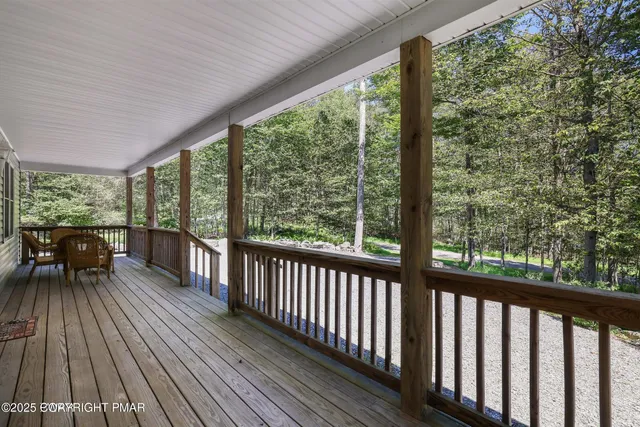 a view of two chairs in the balcony