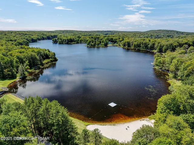 a view of a lake with houses in the back