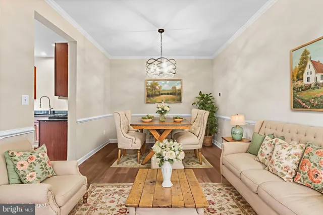 a kitchen with stainless steel appliances granite countertop a stove a sink dishwasher and a microwave with wooden cabinets