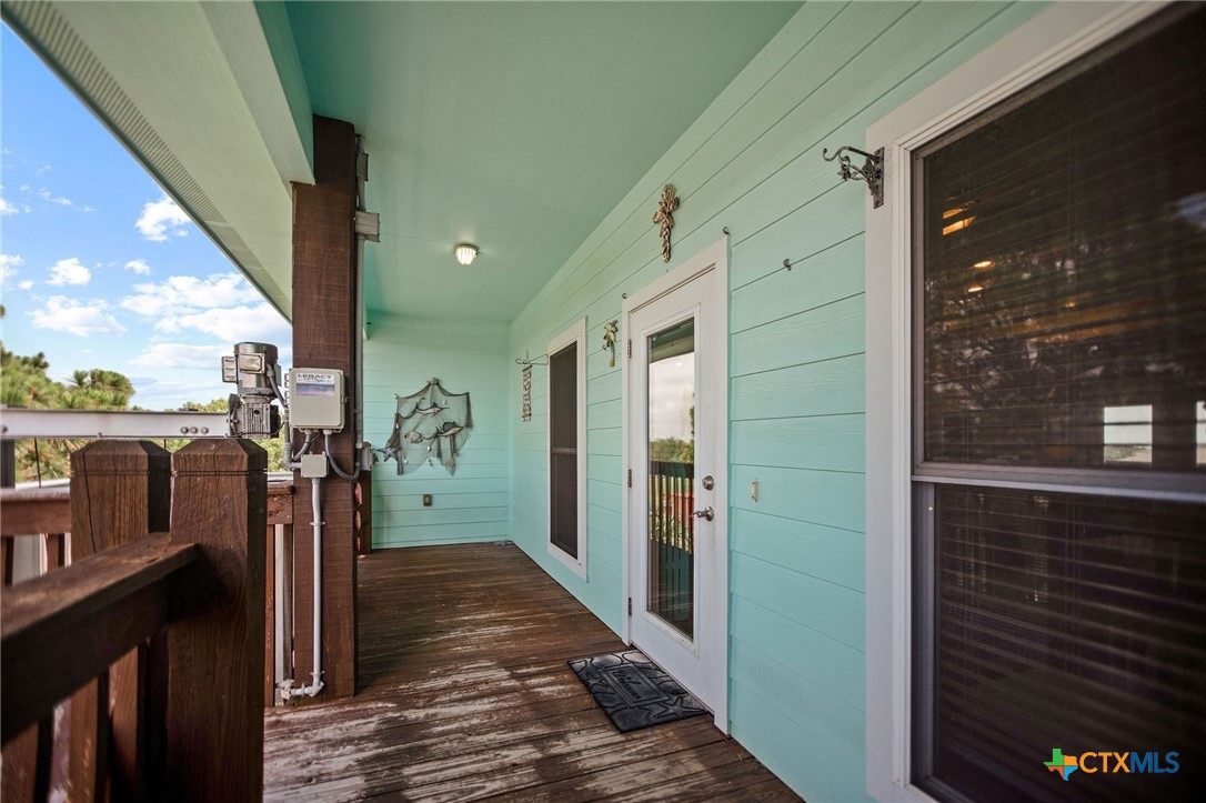 23 Macey Street Port O'Connor, TX 77982 - Photo 10 of 47 a view of a hallway with wooden floor