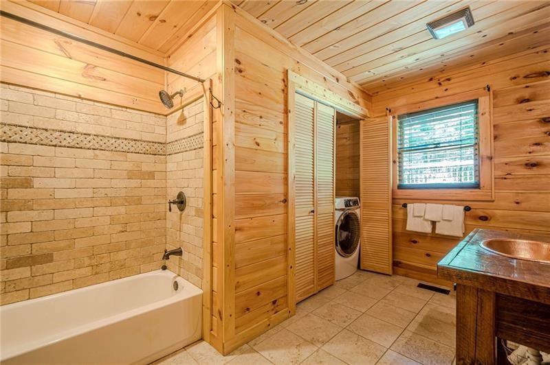213 Moonshine Hollow Blue Ridge, GA 30513 - Photo 14 of 41 a bathroom with a sink and a bathtub