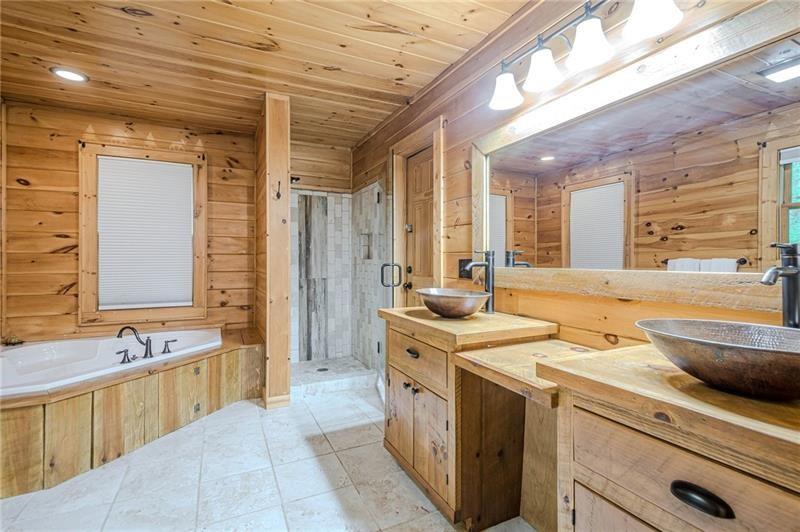 213 Moonshine Hollow Blue Ridge, GA 30513 - Photo 18 of 41 a view of a kitchen with a sink and dishwasher with wooden floor